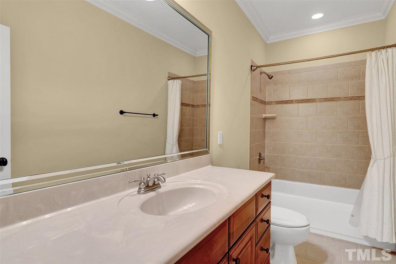 403 Yarmouth Road Raleigh, NC 27608 - Photo 21 of 30 a bathroom with a sink a toilet and shower