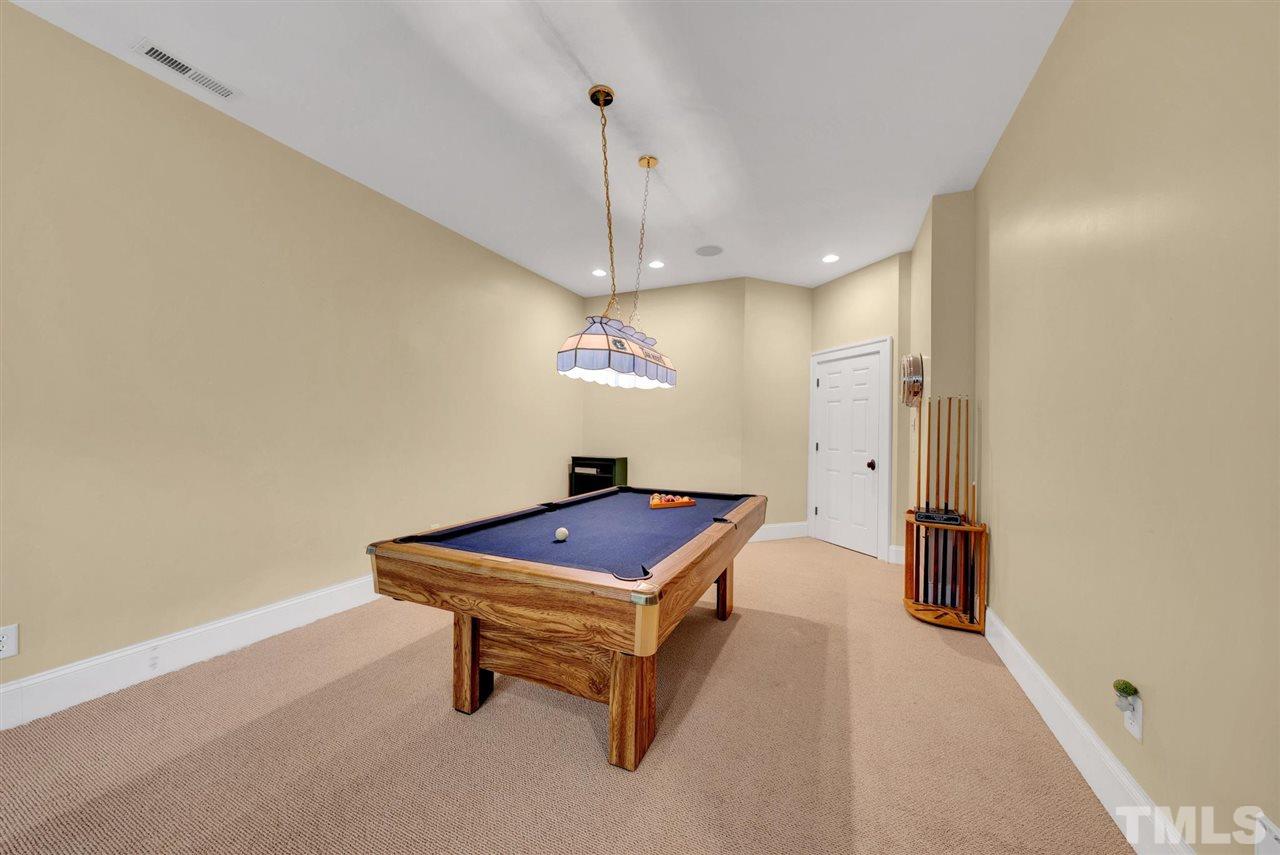 403 Yarmouth Road Raleigh, NC 27608 - Photo 25 of 30 a room with pool table and wooden floor