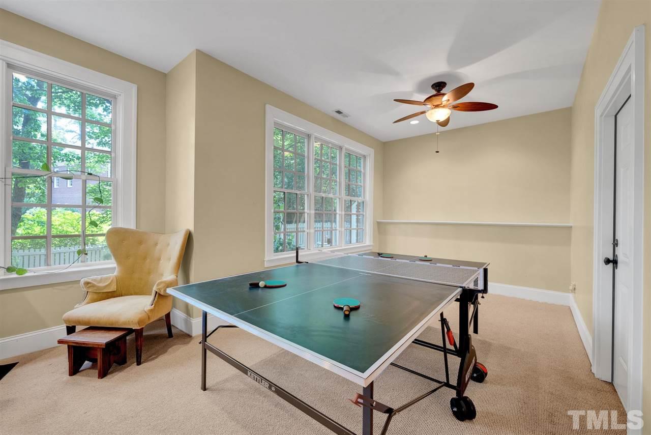 403 Yarmouth Road Raleigh, NC 27608 - Photo 26 of 30 a living room with a table chairs and a window