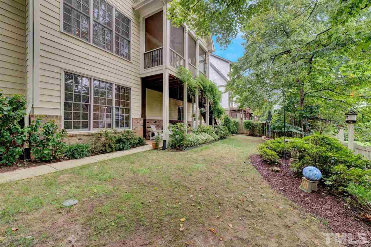 403 Yarmouth Road Raleigh, NC 27608 - Photo 29 of 30 a view of a house with a yard and potted plants