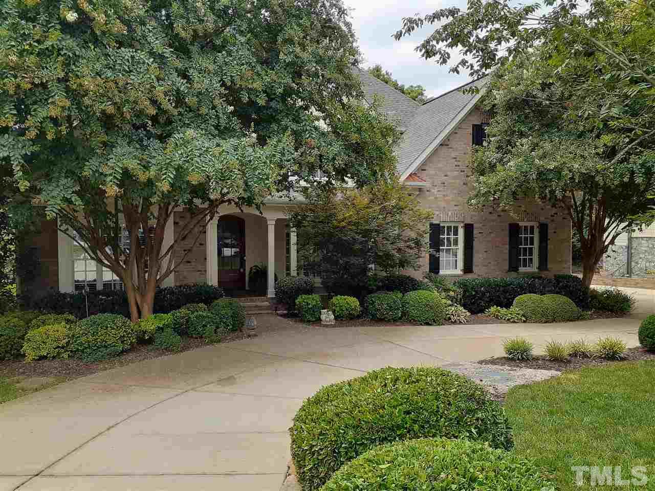 403 Yarmouth Road Raleigh, NC 27608 - Photo 6 of 30 a front view of a house with a yard and potted plants