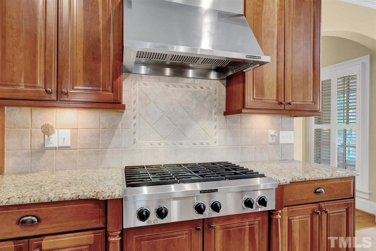 403 Yarmouth Road Raleigh, NC 27608 - Photo 8 of 30 a stove top oven sitting inside of a kitchen