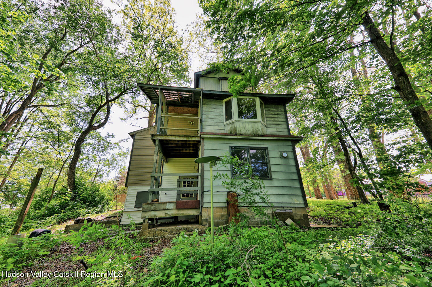 360 Stone Bridge Rd Extension East Durham, NY 12423 - Photo 6 of 83 front view of a house with a tree