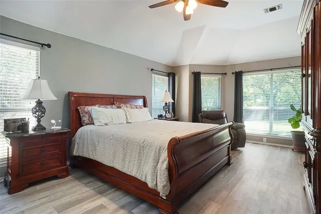 a bedroom with a bed and window