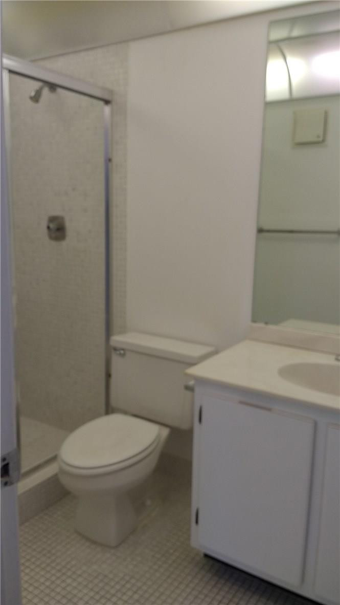 7950 West McNab Road, Unit 304 Tamarac, FL 33321 - Photo 12 of 15 a bathroom with a toilet a sink and shower