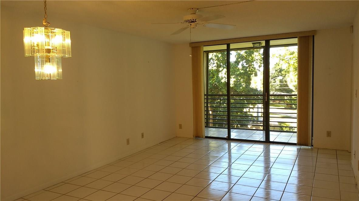 7950 West McNab Road, Unit 304 Tamarac, FL 33321 - Photo 3 of 15 a view of an empty room with a window