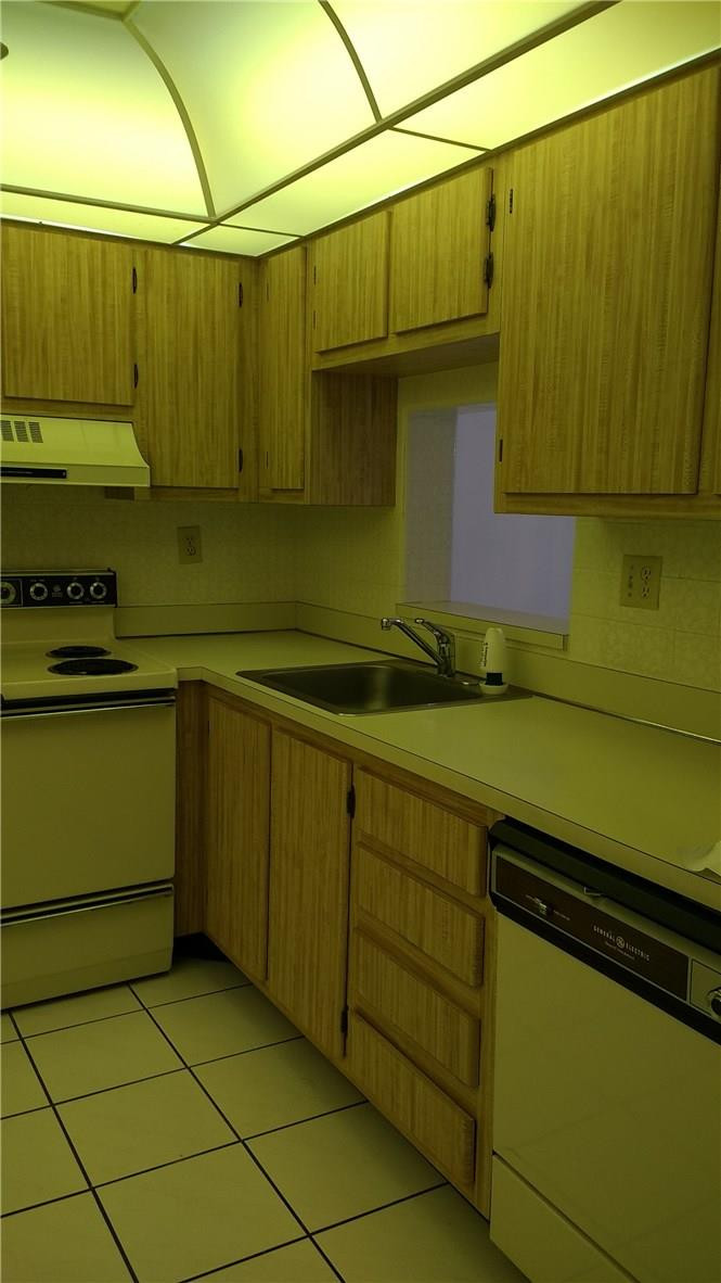 7950 West McNab Road, Unit 304 Tamarac, FL 33321 - Photo 6 of 15 a kitchen with a sink and cabinets