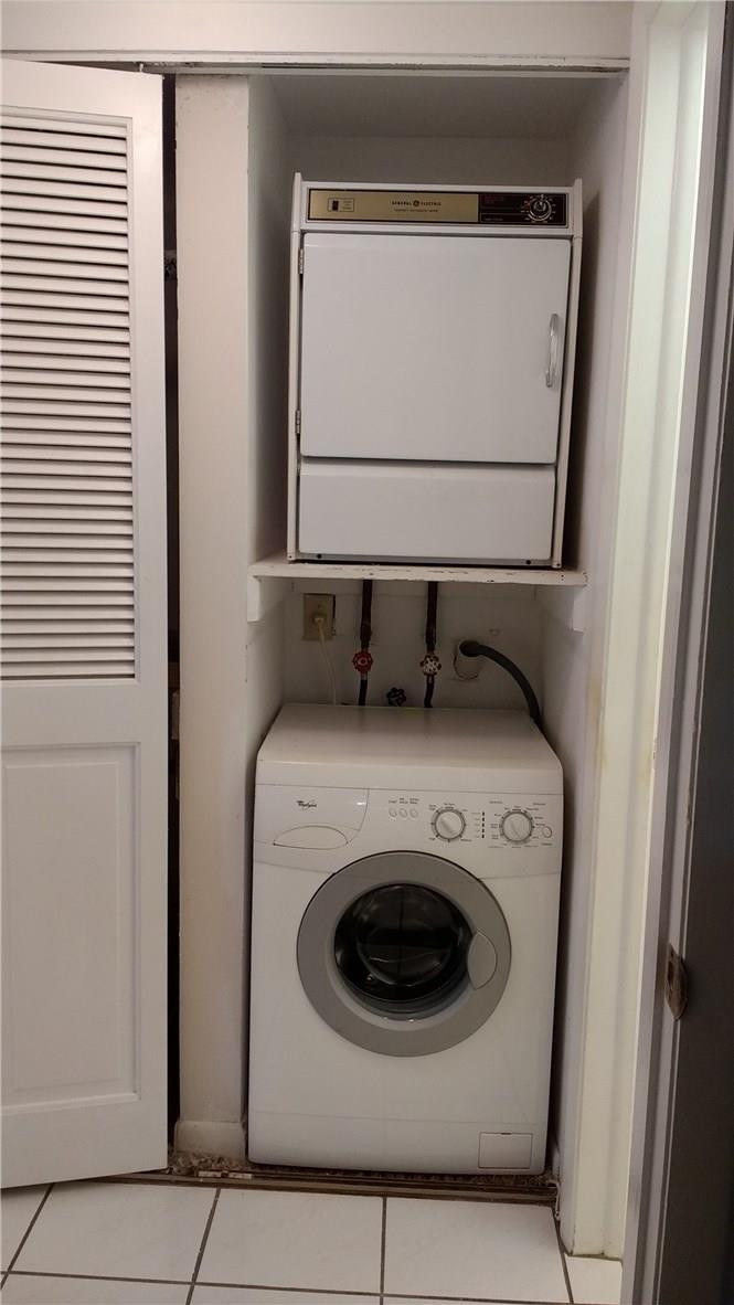 7950 West McNab Road, Unit 304 Tamarac, FL 33321 - Photo 9 of 15 a utility room with dryer and washer