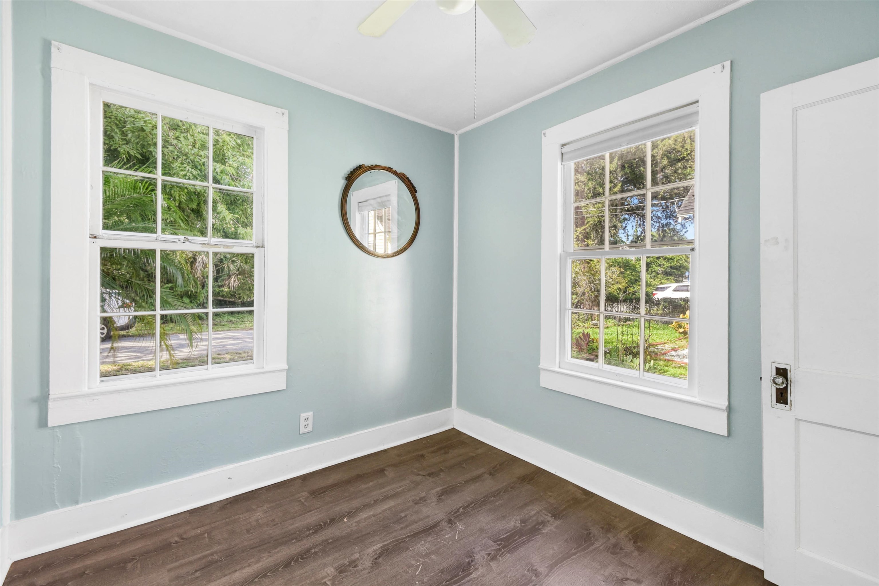 14 Rio Vista Avenue St. Augustine, FL 32084 - Photo 12 of 33 an empty room with wooden floor and windows