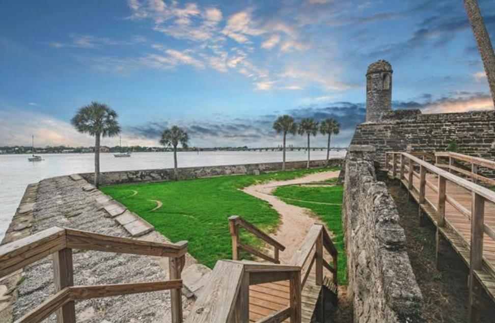 14 Rio Vista Avenue St. Augustine, FL 32084 - Photo 26 of 33 a view of a garden with a bench