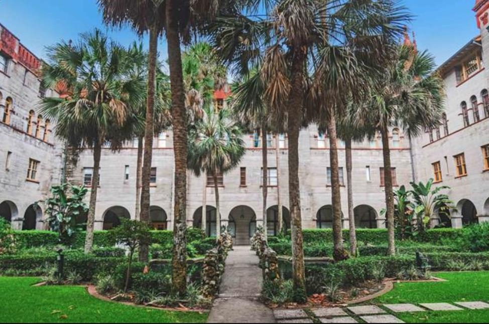 14 Rio Vista Avenue St. Augustine, FL 32084 - Photo 28 of 33 a front view of multi story residential apartment building with yard and green space