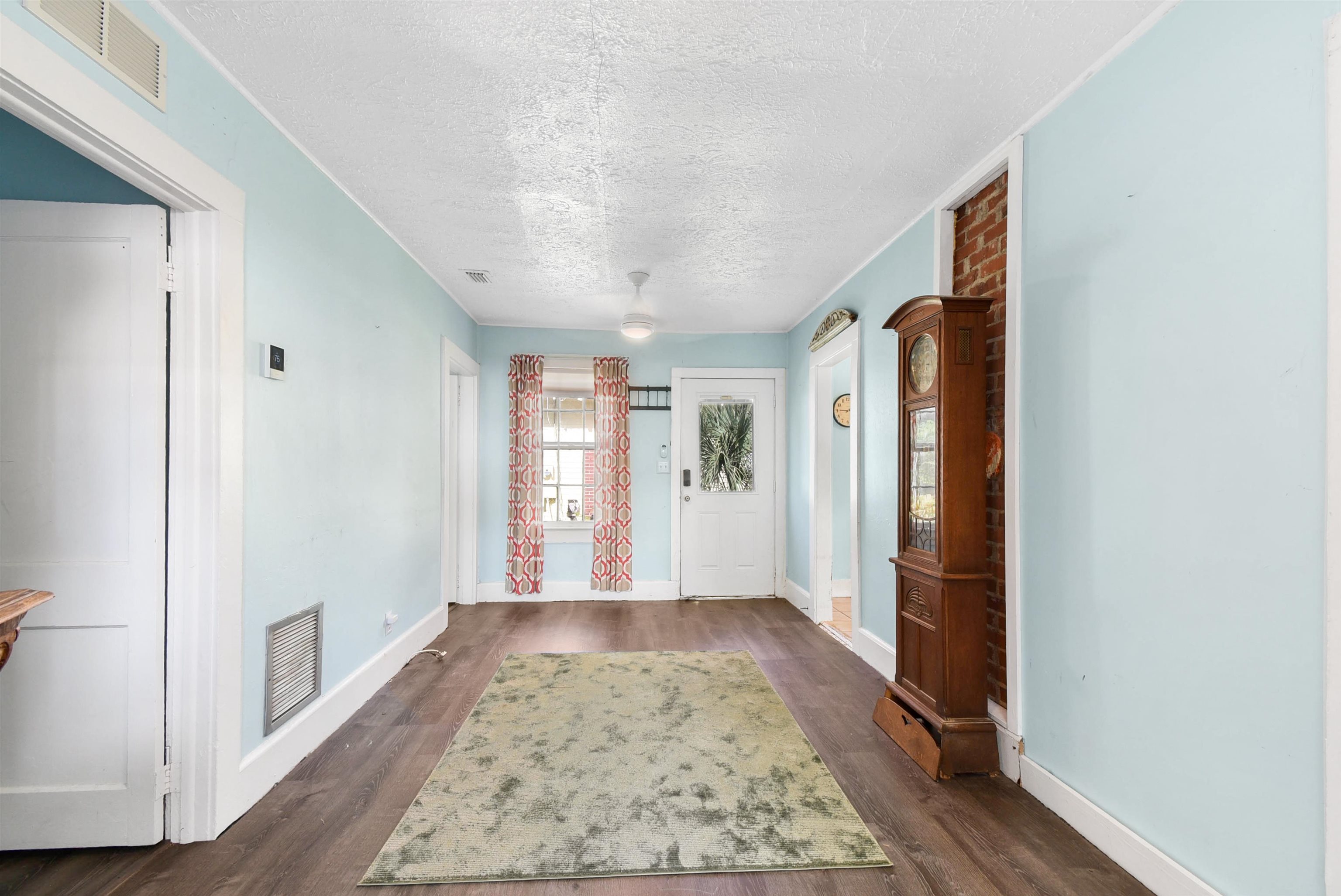 14 Rio Vista Avenue St. Augustine, FL 32084 - Photo 7 of 33 a view of a hallway with wooden floor and windows