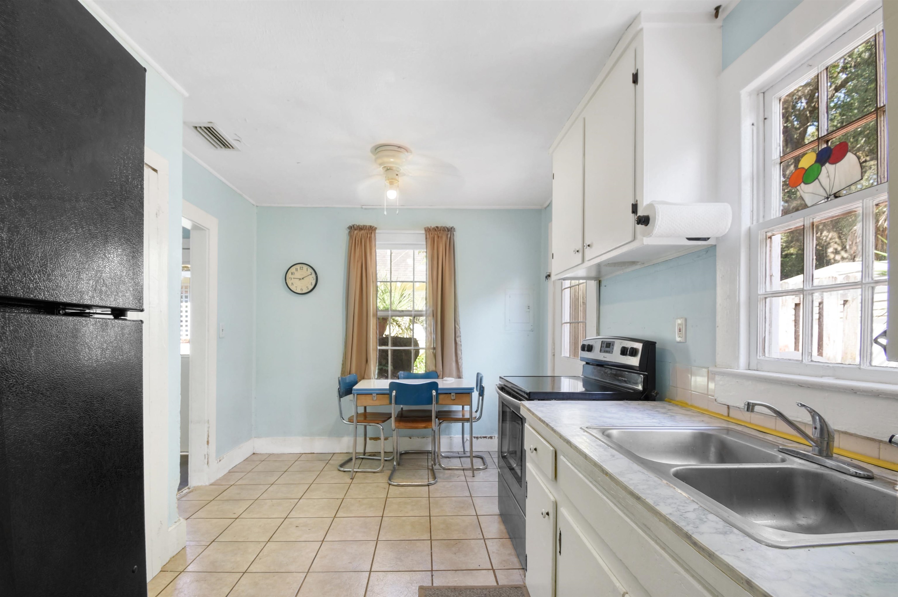 14 Rio Vista Avenue St. Augustine, FL 32084 - Photo 9 of 33 a kitchen with stainless steel appliances granite countertop a sink and a refrigerator