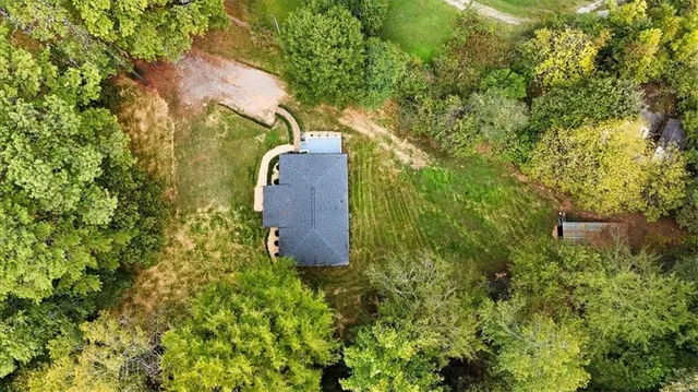 a view of a garden with a building