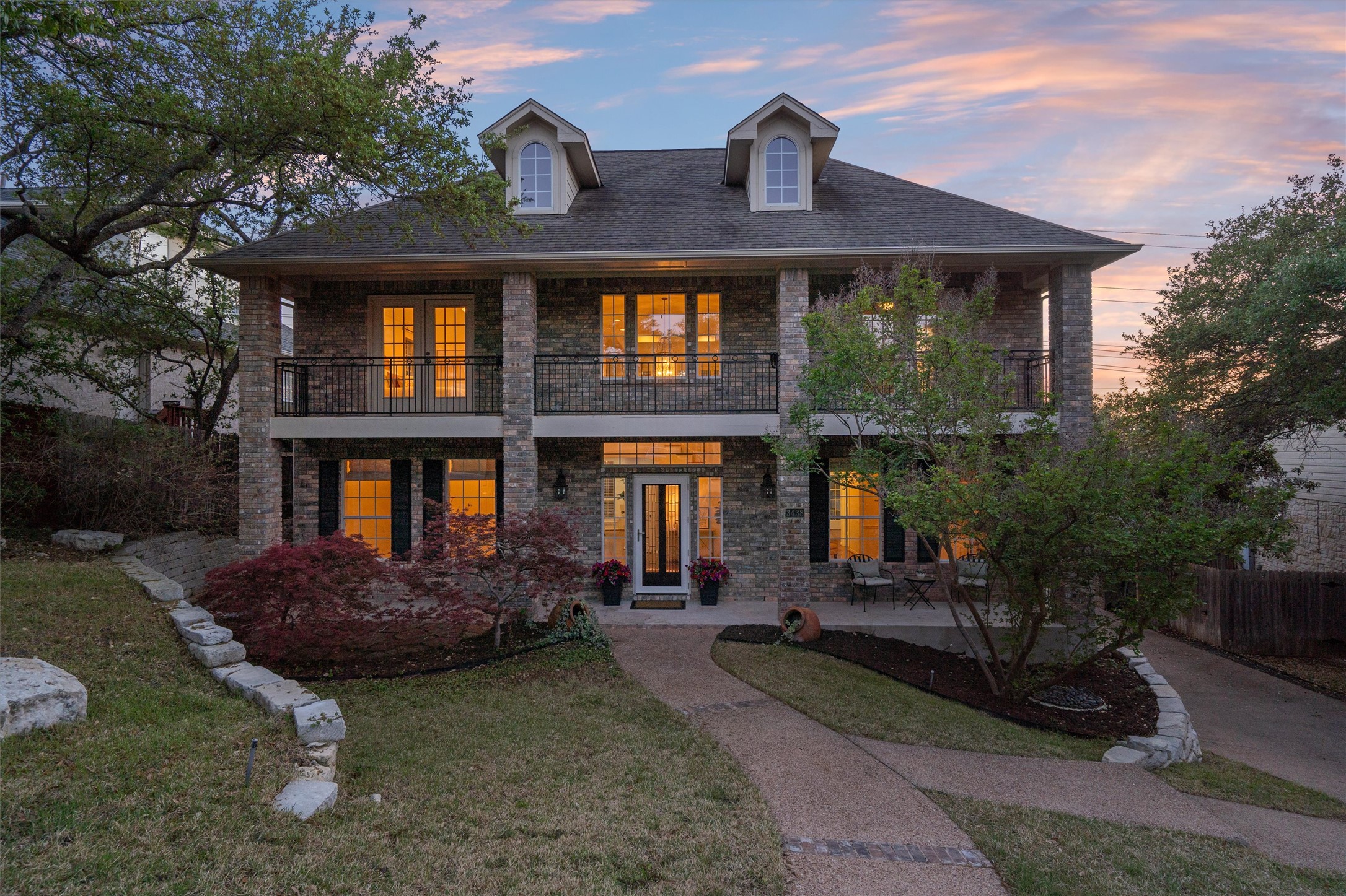 3438 John Simpson Trail Austin, TX 78732 - Photo 1 of 1 a front view of a house with garden