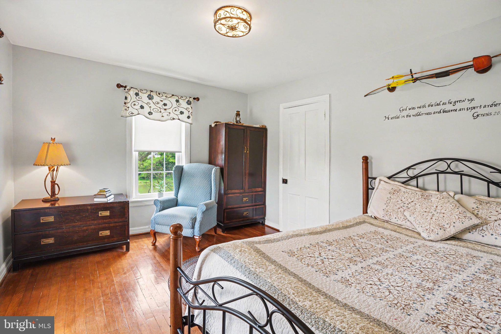 420 Carlisle Road Biglerville, PA 17307 - Photo 24 of 41 a bedroom with a bed and a chandelier