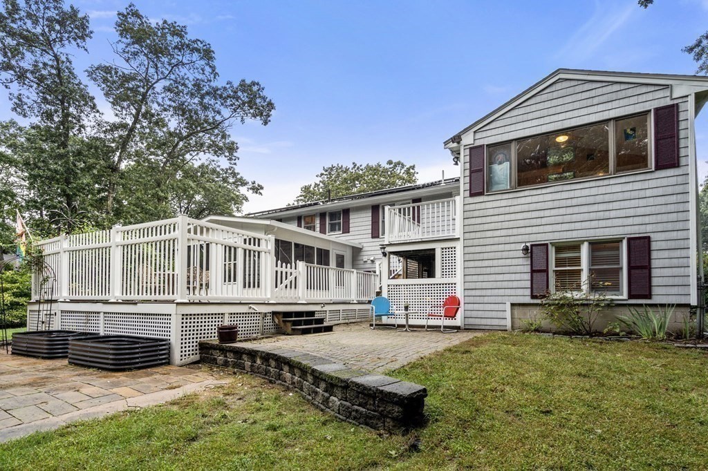 83 Pine Street Natick, MA 01760 - Photo 24 of 28 a house view with a garden space