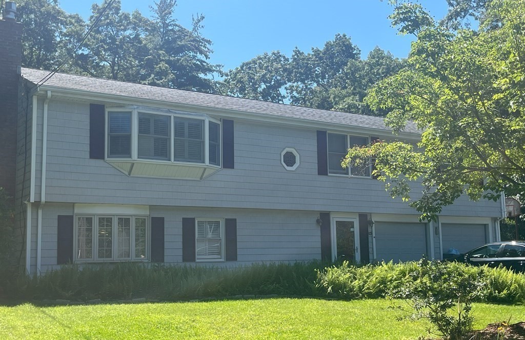 83 Pine Street Natick, MA 01760 - Photo 27 of 28 a view of a house with a yard