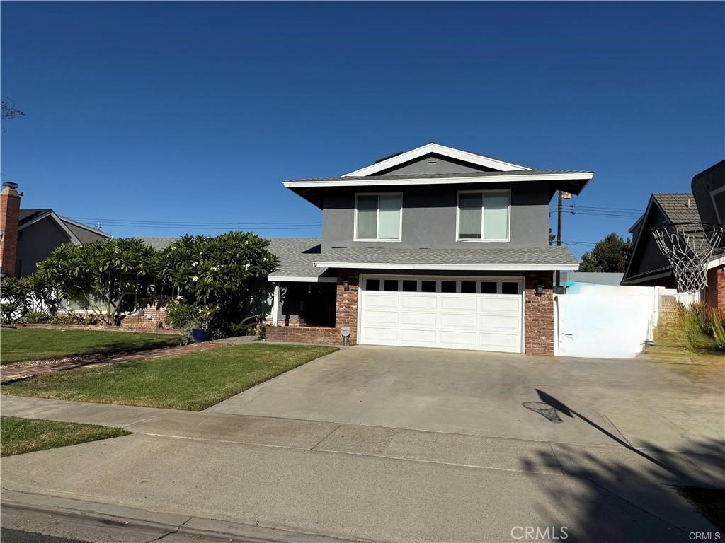 215 Delphia Avenue Brea, CA 92821 - Photo 1 of 1 a front view of a house with a yard