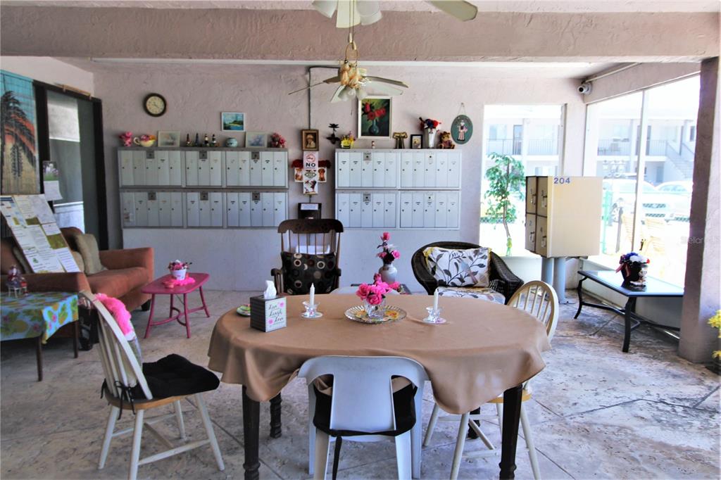 3101 Bee Ridge Road, Unit 209 Sarasota, FL 34239 - Photo 4 of 17 a view of a dining room with furniture and a chandelier
