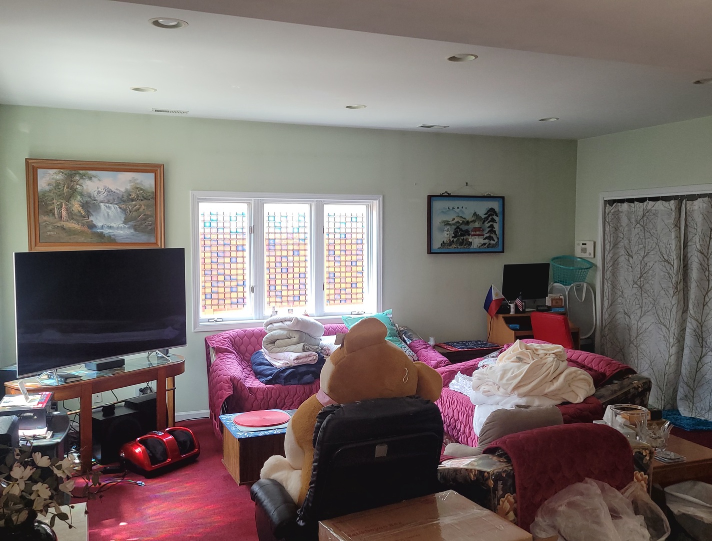 5153 Dobson Street Skokie, IL 60077 - Photo 12 of 27 a bedroom with a bed and a flat screen tv