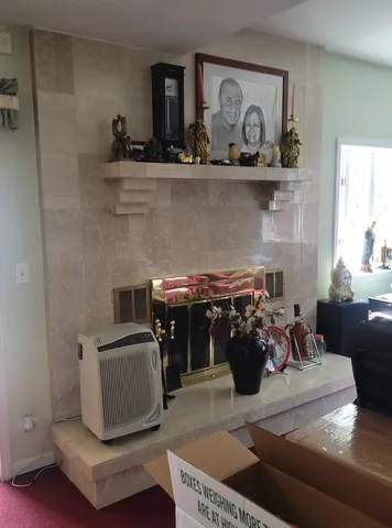 a living room with furniture and flowers