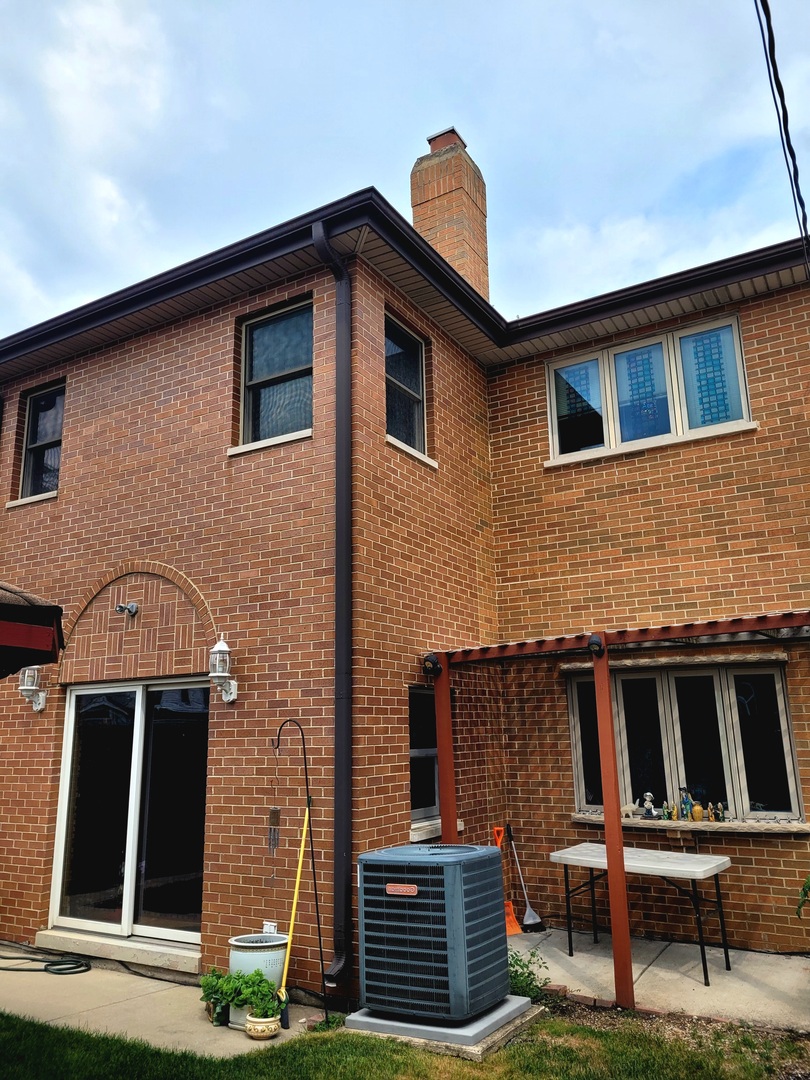 5153 Dobson Street Skokie, IL 60077 - Photo 2 of 27 a front view of a house with garden