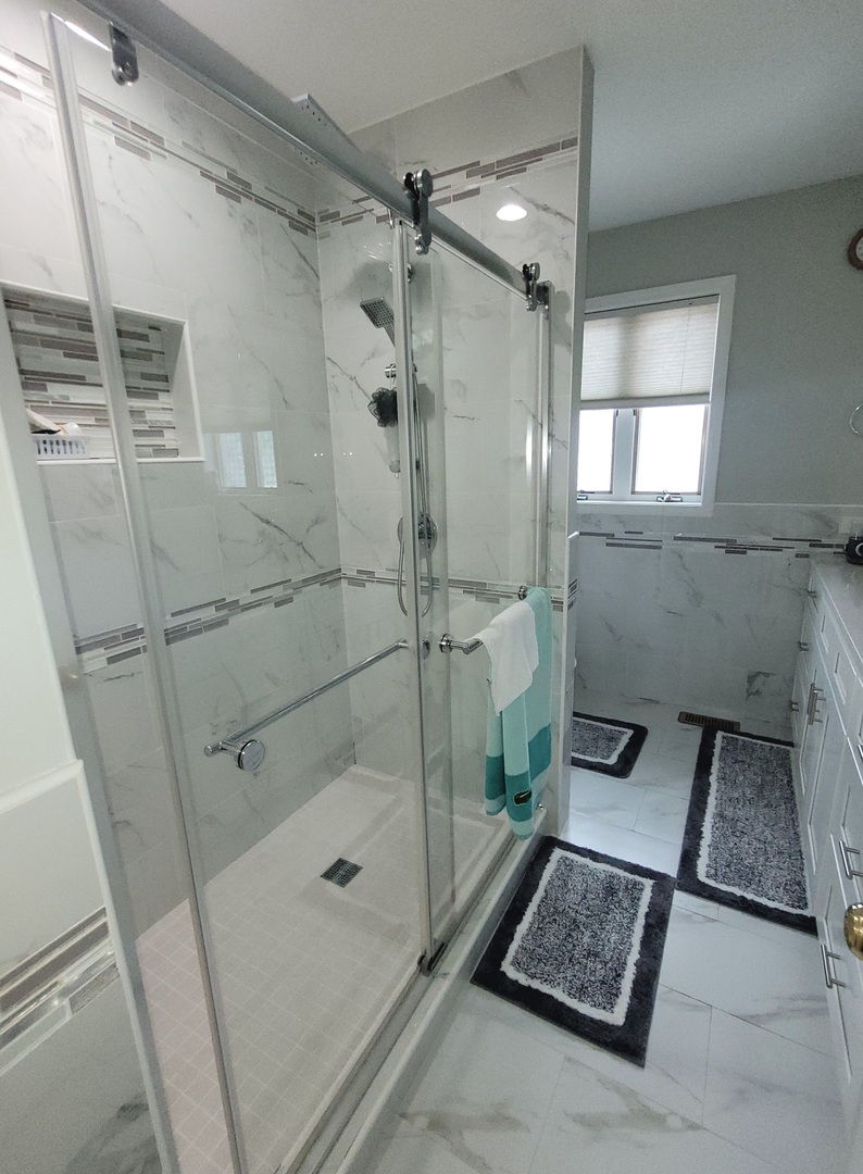 5153 Dobson Street Skokie, IL 60077 - Photo 21 of 27 a bathroom with a shower