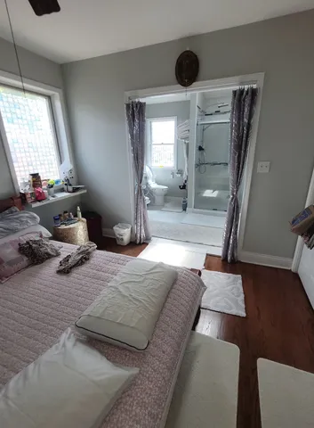 a bedroom with a bed and window