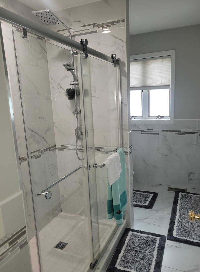 5153 Dobson Street Skokie, IL 60077 - Photo 25 of 27 a bathroom with a shower