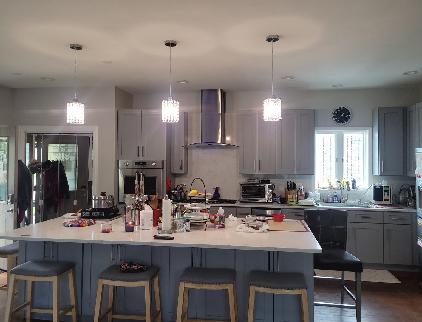 5153 Dobson Street Skokie, IL 60077 - Photo 6 of 27 a kitchen with a sink a stove a refrigerator and chairs