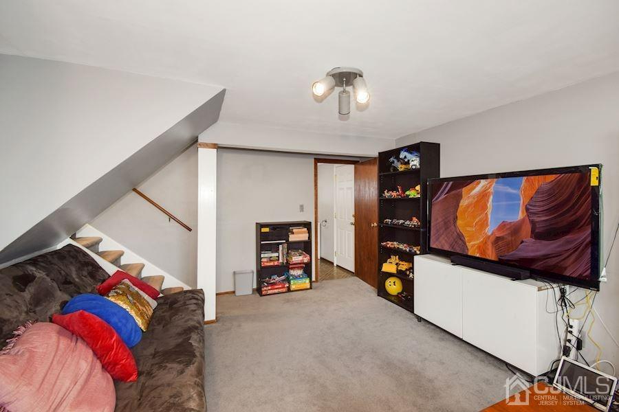 4 Finley Road Edison, NJ 08817 - Photo 14 of 32 a bedroom with a bed and a walk in closet