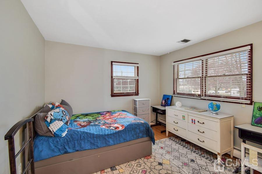 4 Finley Road Edison, NJ 08817 - Photo 16 of 32 a bedroom with furniture and a window