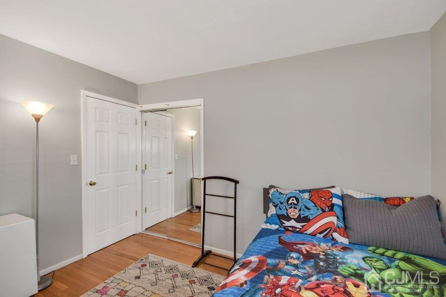 4 Finley Road Edison, NJ 08817 - Photo 17 of 32 a bedroom with a bed and a window