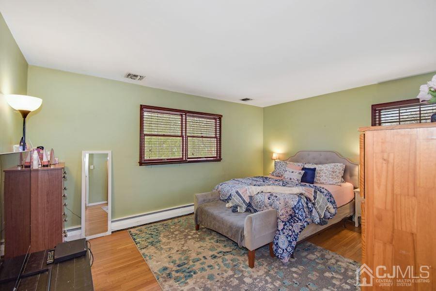 4 Finley Road Edison, NJ 08817 - Photo 18 of 32 a bedroom with a bed and a window