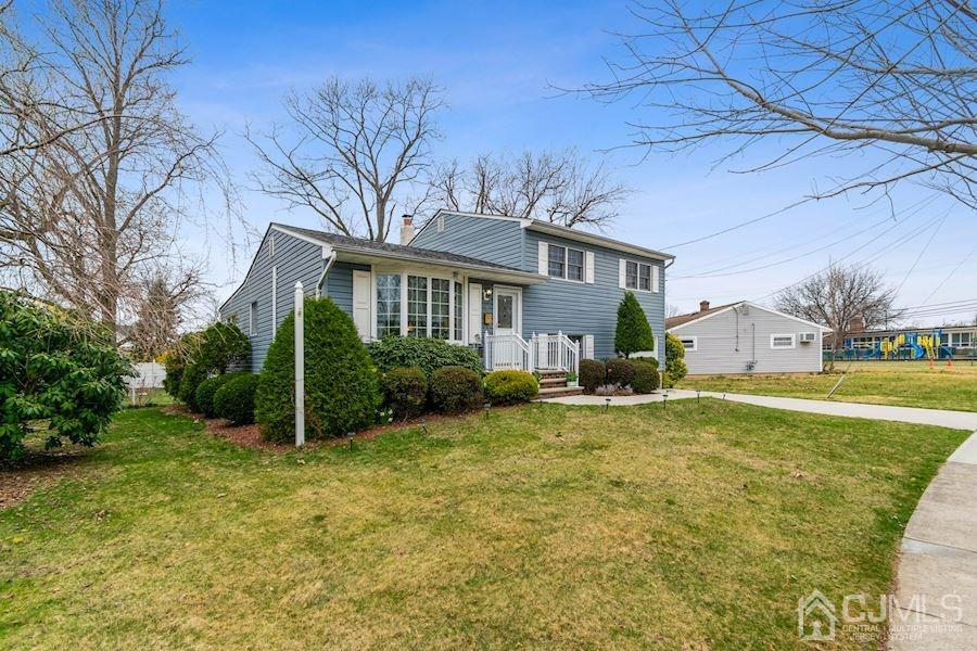 4 Finley Road Edison, NJ 08817 - Photo 2 of 32 a view of a house with backyard and sitting area
