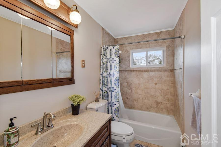 4 Finley Road Edison, NJ 08817 - Photo 21 of 32 a bathroom with a granite countertop sink a toilet and shower