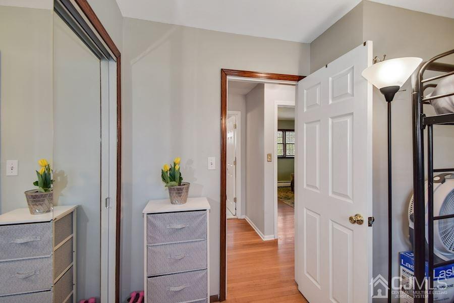 4 Finley Road Edison, NJ 08817 - Photo 22 of 32 a view of hallway with wooden floor and staircase
