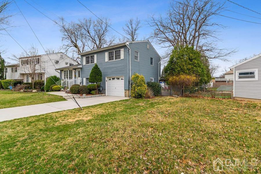 4 Finley Road Edison, NJ 08817 - Photo 3 of 32 a front view of a house with a yard