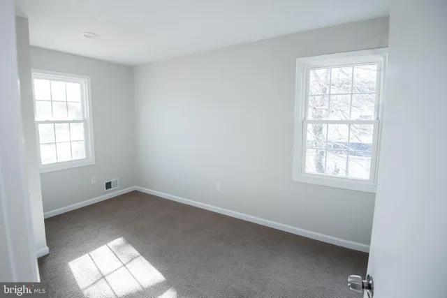 an empty room with windows