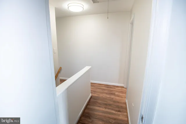 a view of a hallway with stairs