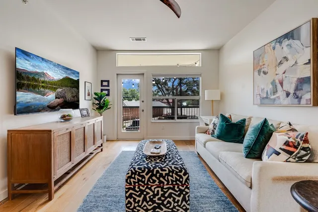 a living room with furniture and a table