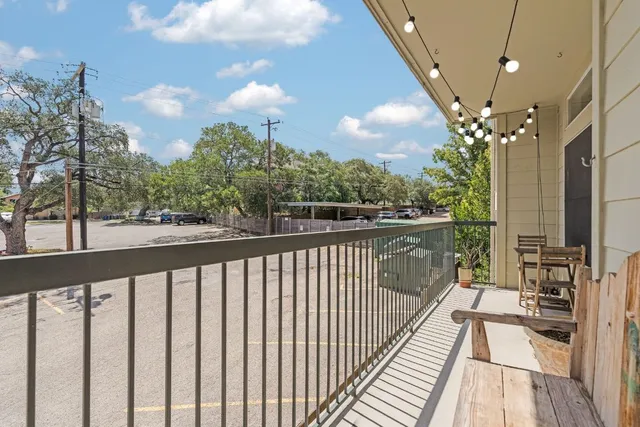 a view of a balcony with wooden floor