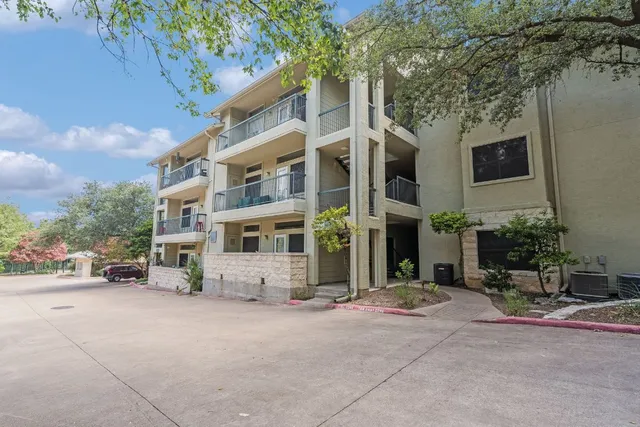 a view of a building with a street