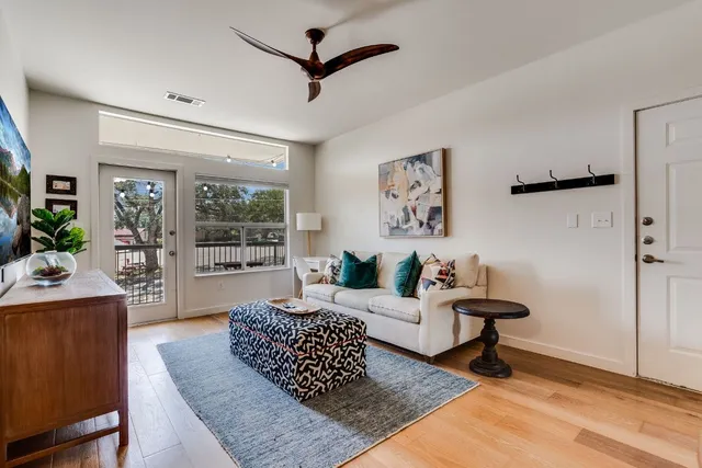 a living room with furniture and a rug