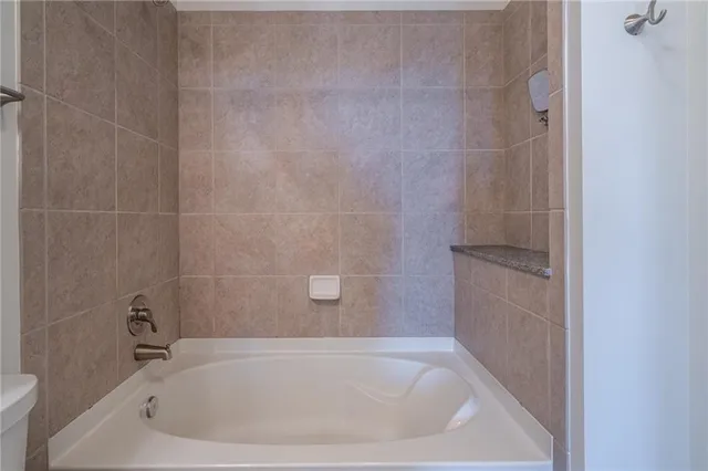 a view of a roof deck with furniture