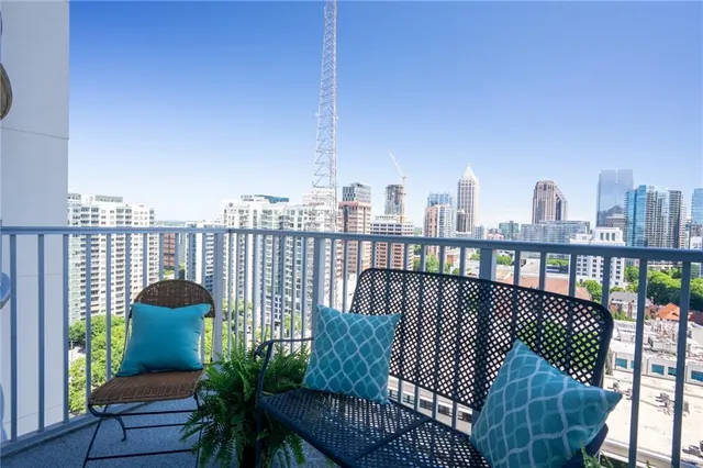 a view of balcony with furniture
