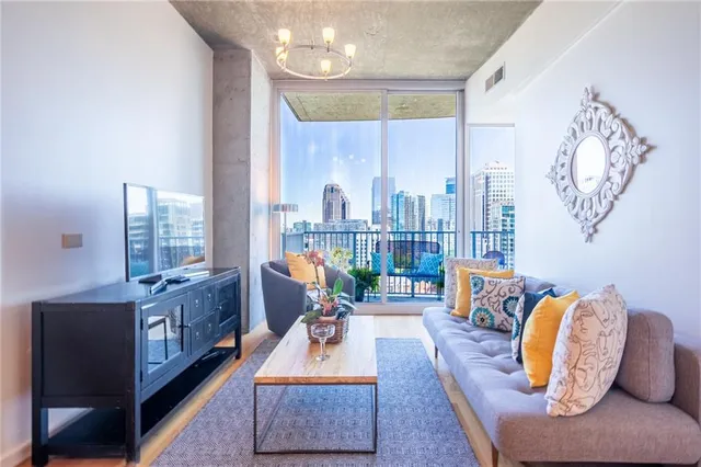 a living room with furniture and a large window