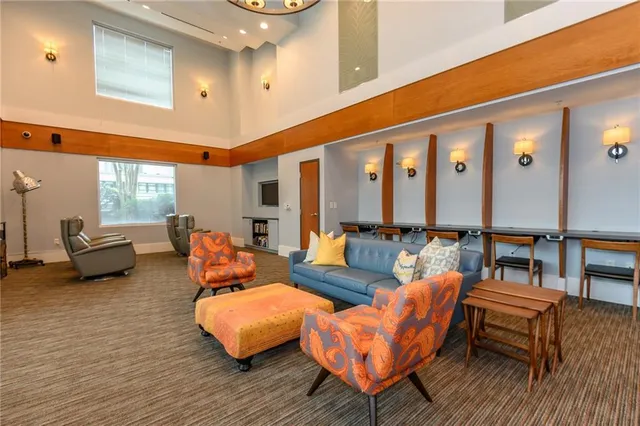 a room with wooden floor table tennis and arcade game machine