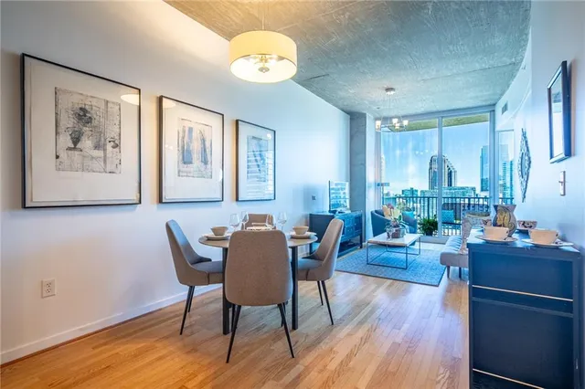 a view of a dining room with furniture window and wooden floor